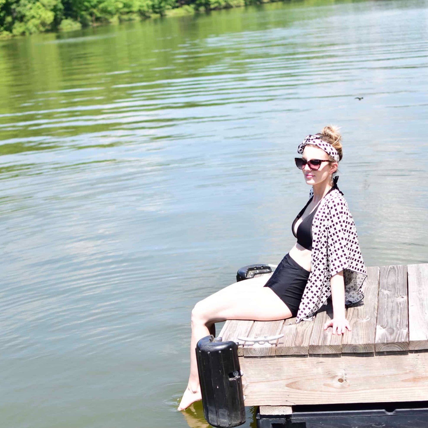 Shawl wrap styled as a bathing suit cover up near lake.